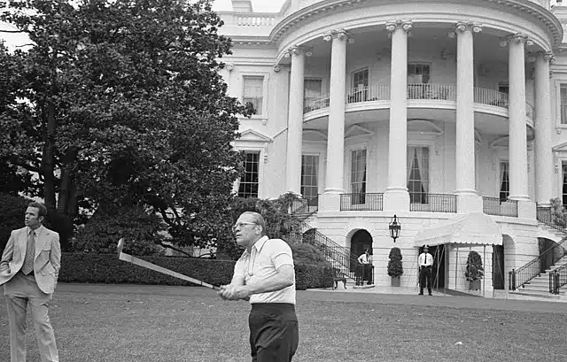 Gerald Ford playing golf in front of white house