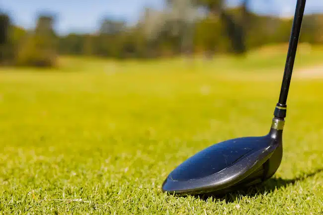 A closeup of golf club on a Fairway at a golf course