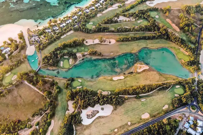 View from the height of the island of Mauritius in the Indian Ocean and the golf course on the Le Morne peninsula