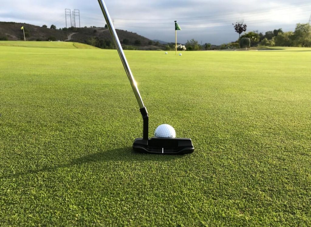 putting towards hole on green