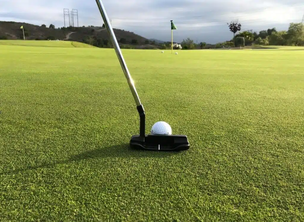 putting towards hole on green