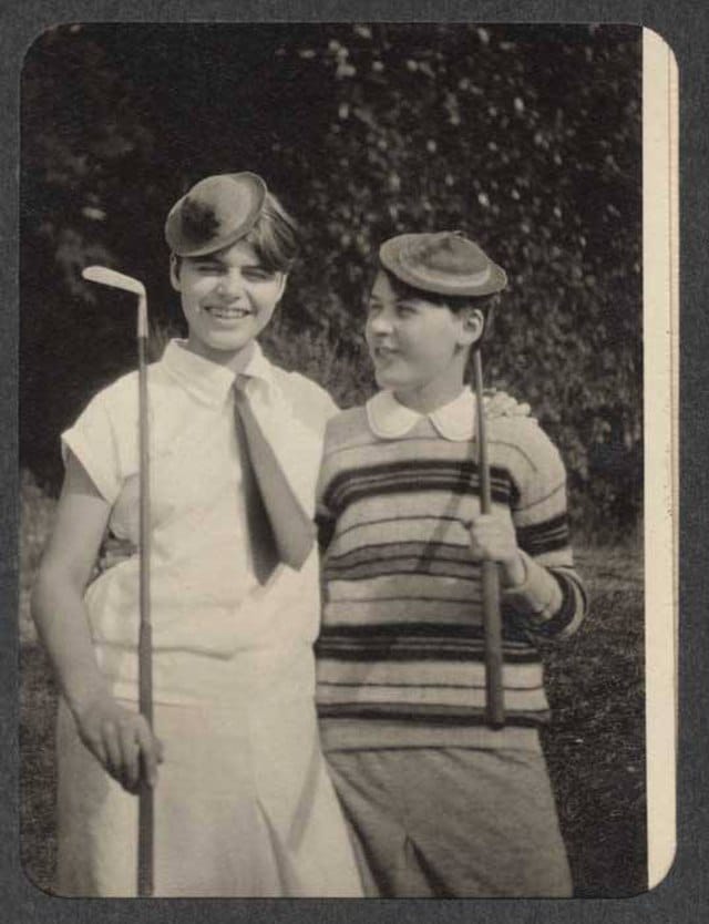 Two_children_holding_golf_clubs,_ca_1920_(MOHAI_7449)