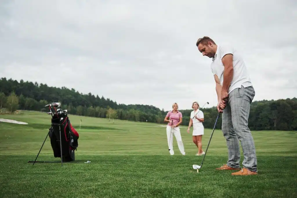 Group of stylish friends on the golf course learn to play a new game.