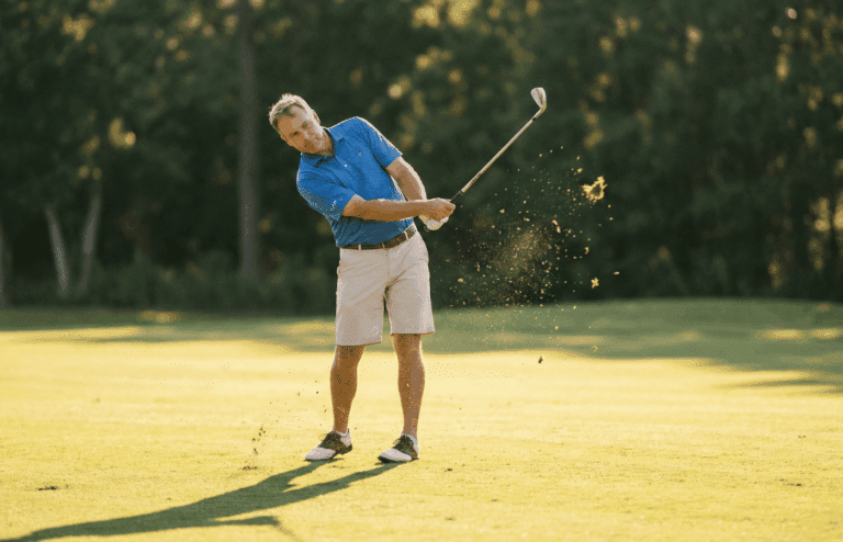 A high handicap golfer using an iron for more forgiveness.