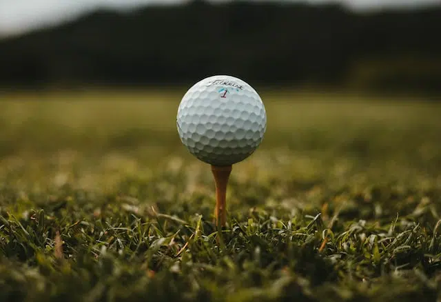 Titleist golf ball on a tee - Photo by <a href="https://unsplash.com/@will0629?utm_source=unsplash&utm_medium=referral&utm_content=creditCopyText">Will Porada</a> on <a href="https://unsplash.com/s/photos/golf-ball?utm_source=unsplash&utm_medium=referral&utm_content=creditCopyText">Unsplash</a> 