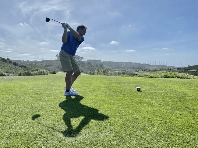 A-man-tees-off-swings-and-hits-a-drive-on-the-go-2022-11-01-02-03-09-utc