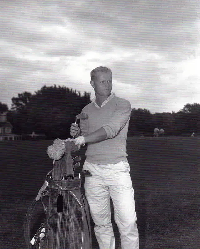 jack nicklaus net worth older photo when he's younger with golf club set in black and white