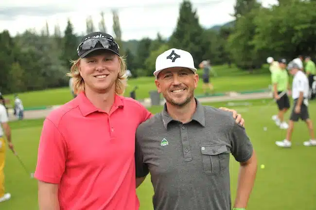 guys posing for a picture at a pro am golf event