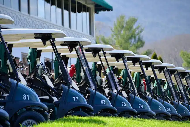 row-of-golf-carts-lined-up-ready-to-head-out-for-a-2022-11-14-04-09-57-utc