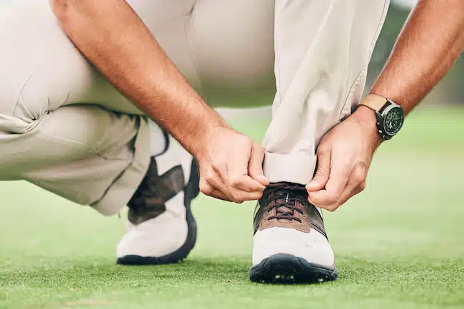 shoe-ready-and-man-tying-laces-for-golf-preparin-2023-03-23-23-55-02-utc