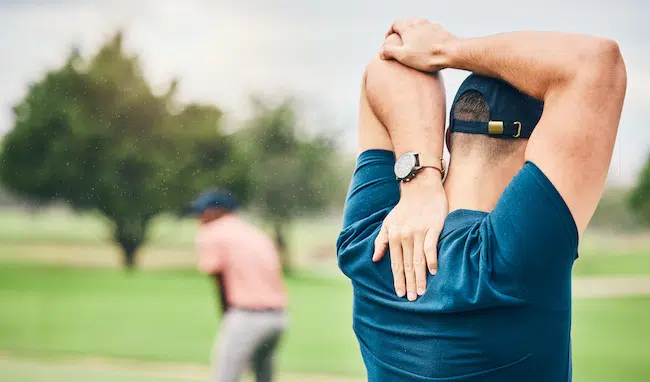 Golf-sports-and-man-stretching-arms-on-course-for-2023-03-24-02-24-53-utc