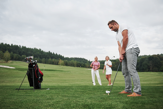 Group-of-stylish-friends-on-the-golf-course-learn-2021-08-29-18-28-06-utc