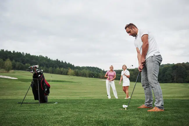 Group-of-stylish-friends-on-the-golf-course-learn-2021-08-29-18-28-06-utc