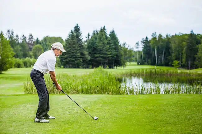 Mature Golfer on a Golf Course driving