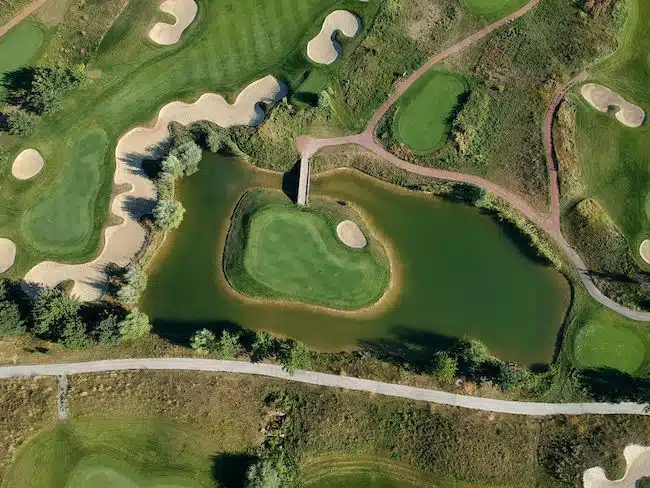 Aerial view of the green grass of the golf course.