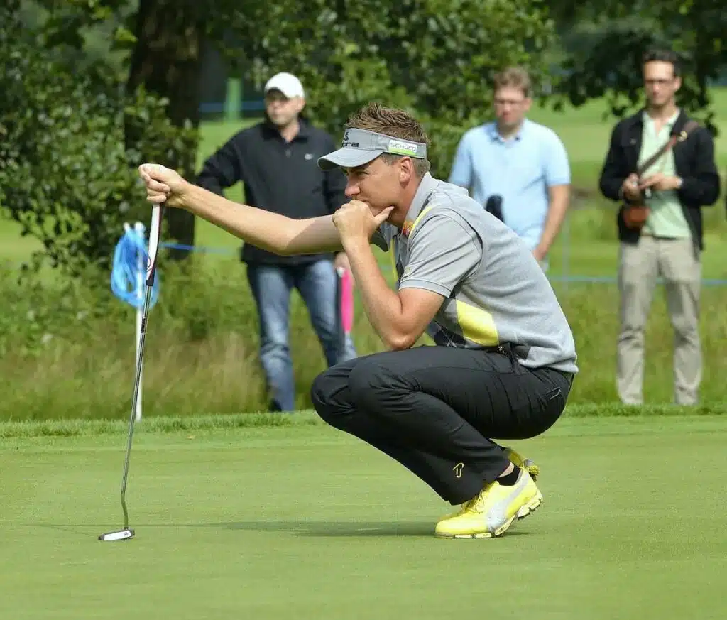 best british golfers IanPoulter lining up a putt