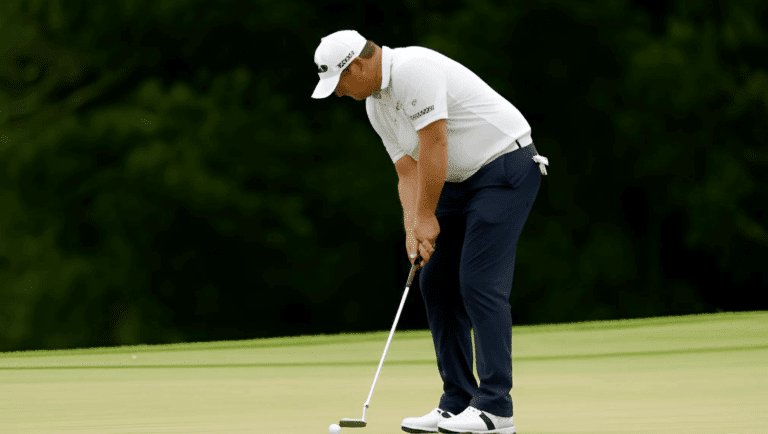A golfer misses a putt a the Tour Championship.