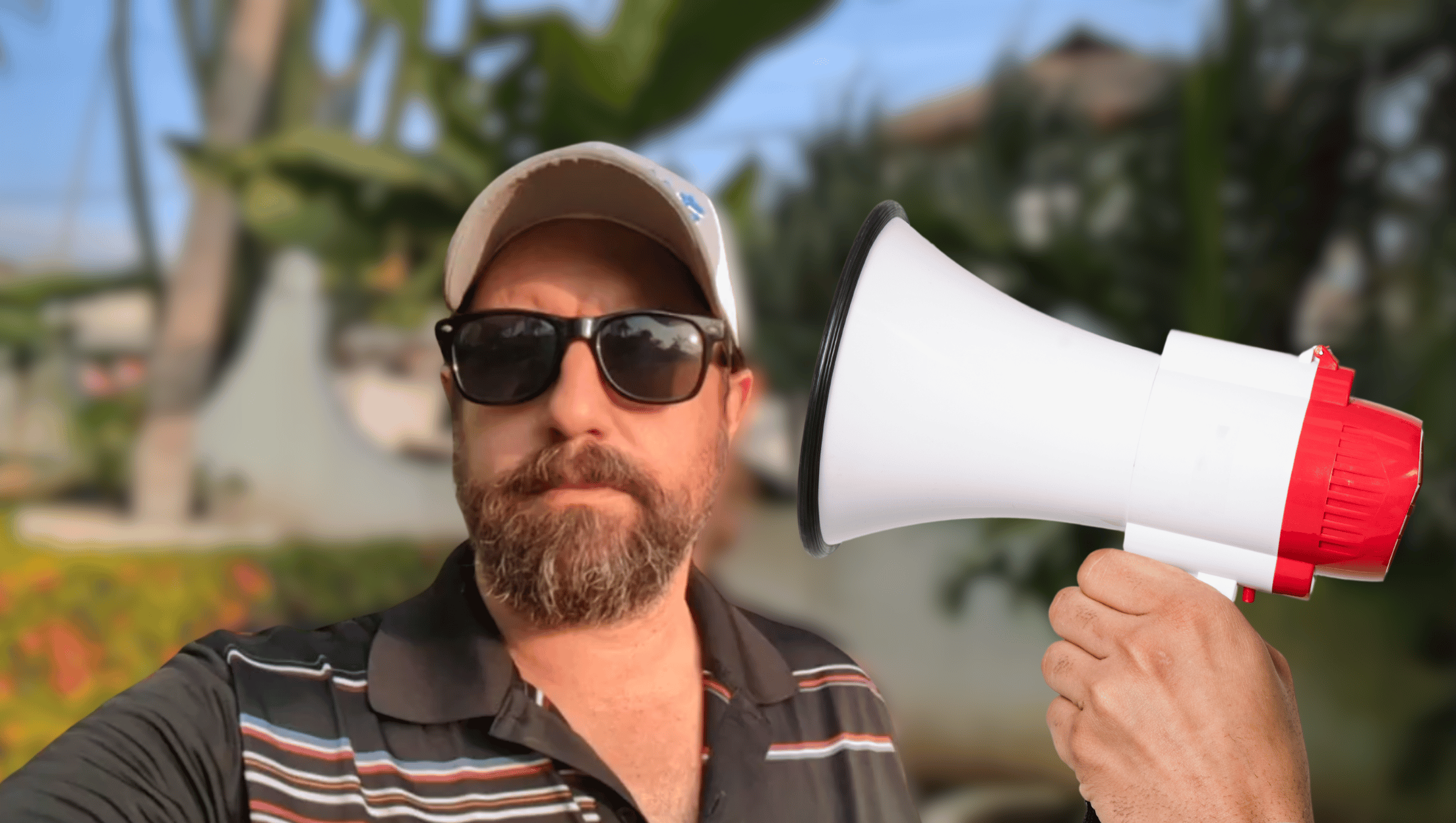 A golfer being heckled with a megaphone.