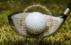 A macro, high-speed action shot capturing the exact millisecond a driver clubface strikes a golf ball.