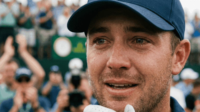 A close up of a golfer's crying face after winning a tournament.
