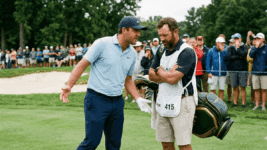 A golfer yells at his caddy