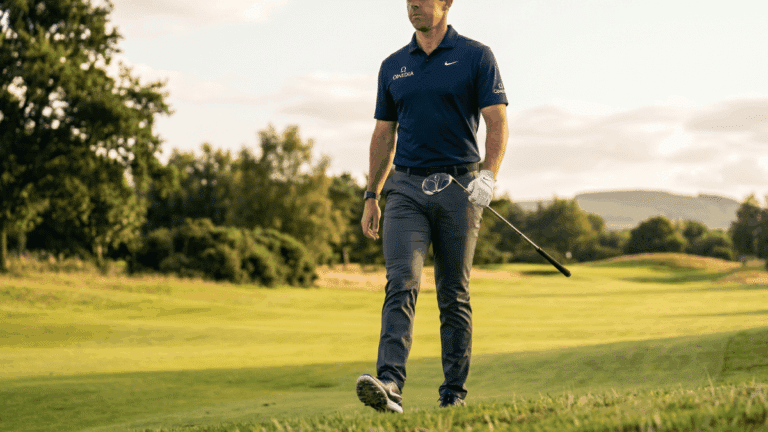 Rory walking on the fairway at the golf course.